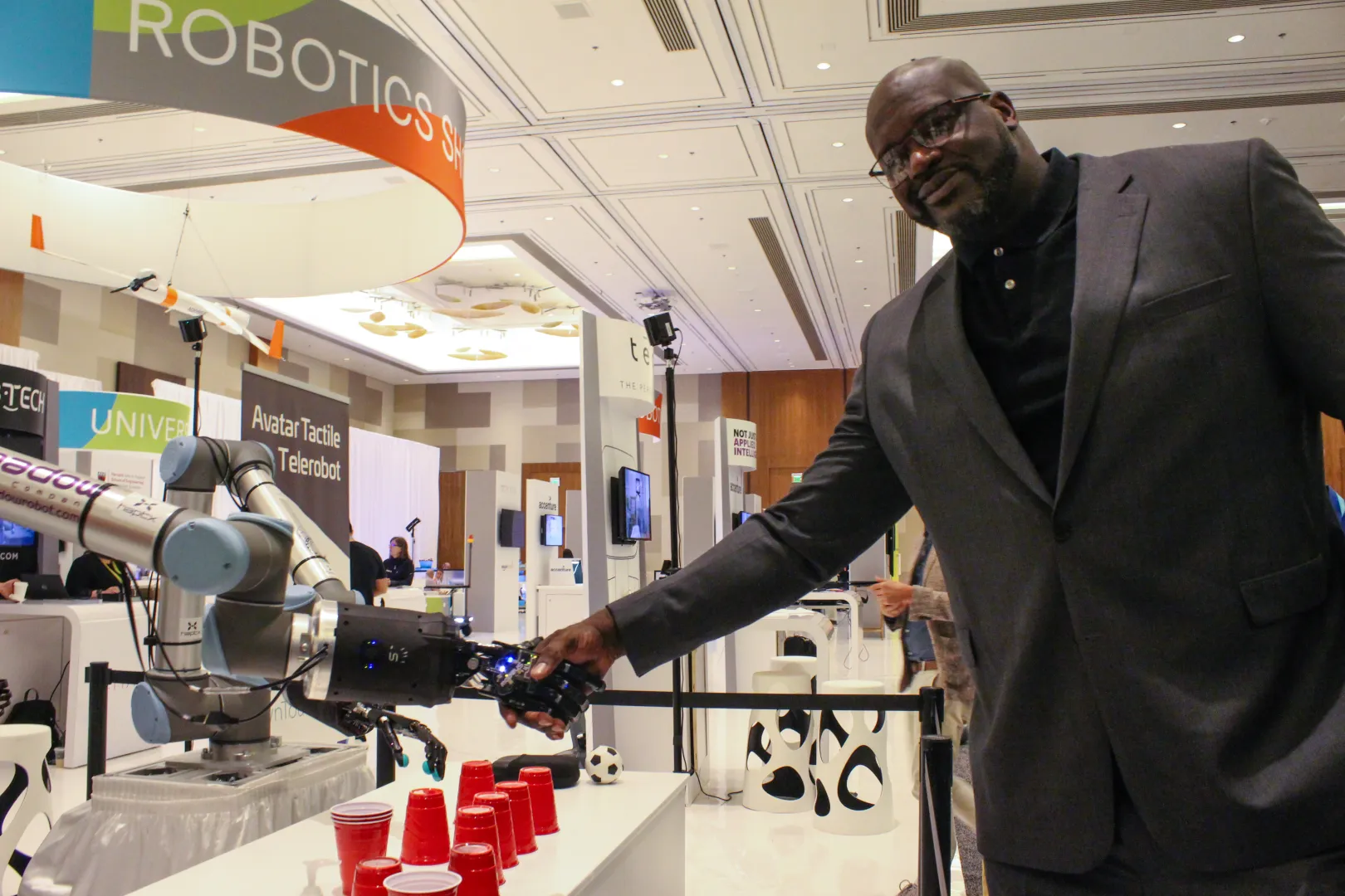 Telerobot shaking hands with Shaq