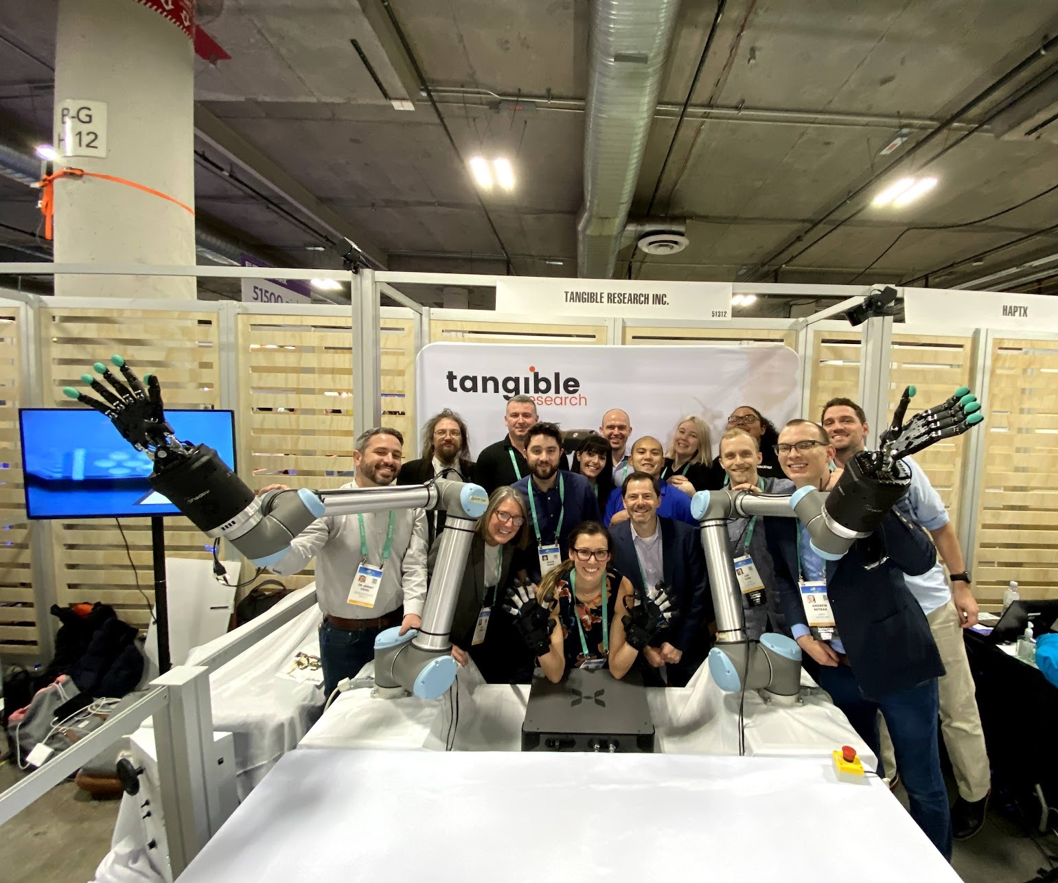 HaptX and Shadow Robot Teams posing with Tactile Telerobot at CES 2020